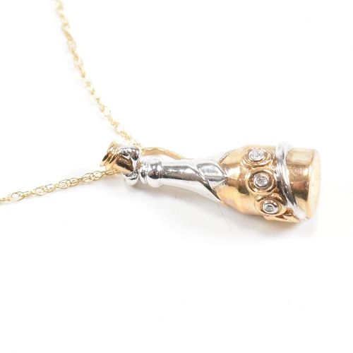 397 - A hallmarked 9ct gold and diamond millennium pendant necklace. The necklace strung with a diamond se... 