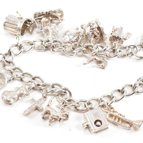 399 - A hallmarked silver bracelet. The bracelet having a hallmarked padlock clasp strung with multiple ch... 