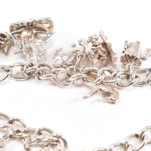399 - A hallmarked silver bracelet. The bracelet having a hallmarked padlock clasp strung with multiple ch... 