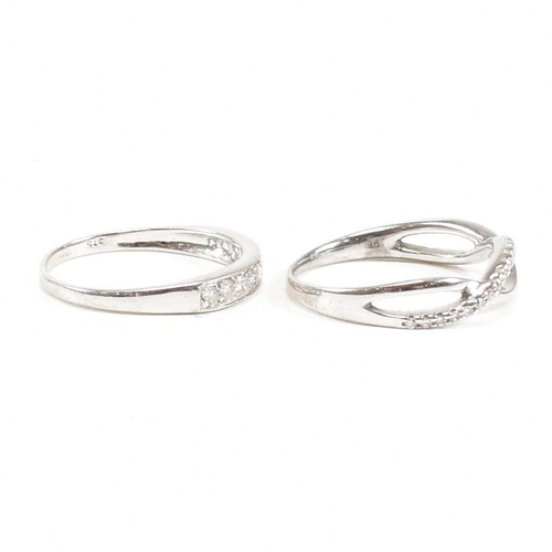 40 - Two hallmarked 9ct white gold and diamond rings. A half eternity ring and diamond set swirl ring. We... 