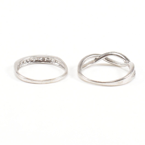 40 - Two hallmarked 9ct white gold and diamond rings. A half eternity ring and diamond set swirl ring. We... 