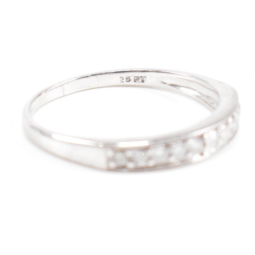 40 - Two hallmarked 9ct white gold and diamond rings. A half eternity ring and diamond set swirl ring. We... 