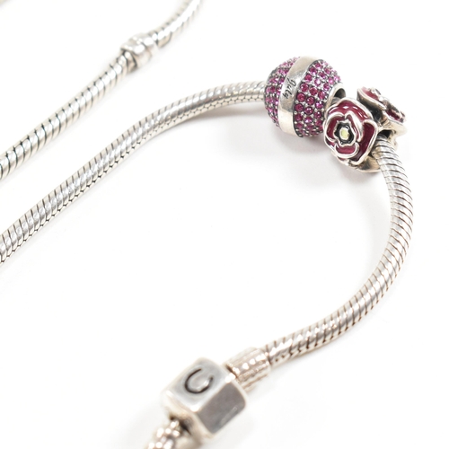 404 - Four 925 silver bracelets. A hallmarked Chamilia bracelet with rose and pink ball charm. A Pandora b... 