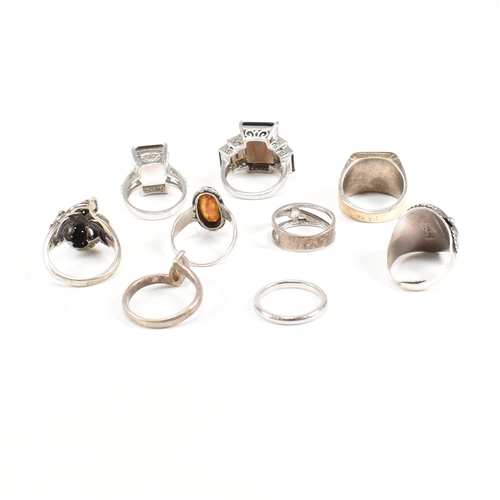 406 - A collection of 925 silver and gem set rings. The rings to include smoky quartz, hematite, paste, ba... 