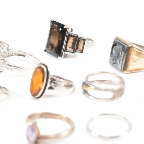 406 - A collection of 925 silver and gem set rings. The rings to include smoky quartz, hematite, paste, ba... 