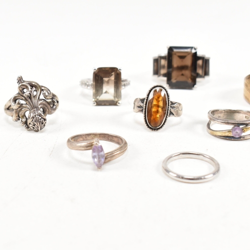 406 - A collection of 925 silver and gem set rings. The rings to include smoky quartz, hematite, paste, ba... 