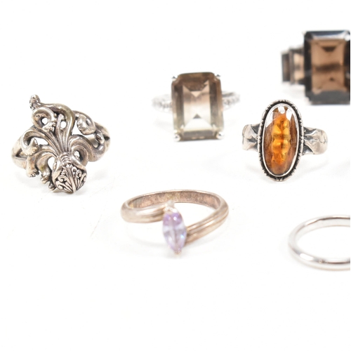 406 - A collection of 925 silver and gem set rings. The rings to include smoky quartz, hematite, paste, ba... 