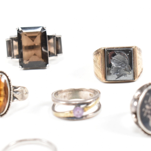 406 - A collection of 925 silver and gem set rings. The rings to include smoky quartz, hematite, paste, ba... 