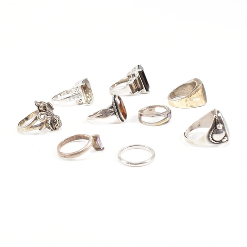 406 - A collection of 925 silver and gem set rings. The rings to include smoky quartz, hematite, paste, ba... 