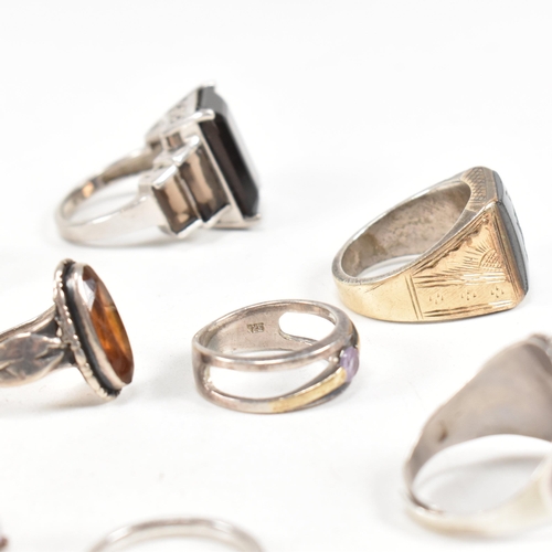 406 - A collection of 925 silver and gem set rings. The rings to include smoky quartz, hematite, paste, ba... 