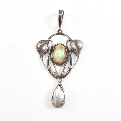 41 - An Arts and Crafts silver opal and mother of pearl necklace pendant.  The pendant having a mother of... 