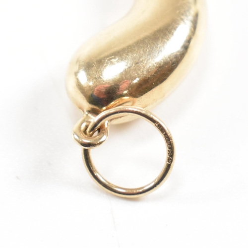 411 - A hallmarked 9ct gold horn of plenty pendant. Import mark for London to bale. Measures 4cm. Weight 1... 