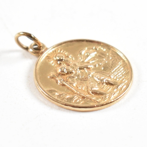 414 - A hallmarked 9ct gold St Christopher pendant and two pairs of gold creole earrings marked 375. Weigh... 