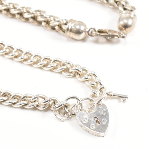 415 - Two 925 silver bracelets. A chunky curb link chain with a padlock clasp marked 925, 18cm.  A ribbed ... 