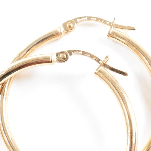 425 - Three pairs of 9ct gold earrings. The earrings to include a large pair of tube hoop earrings, 3cm, m... 