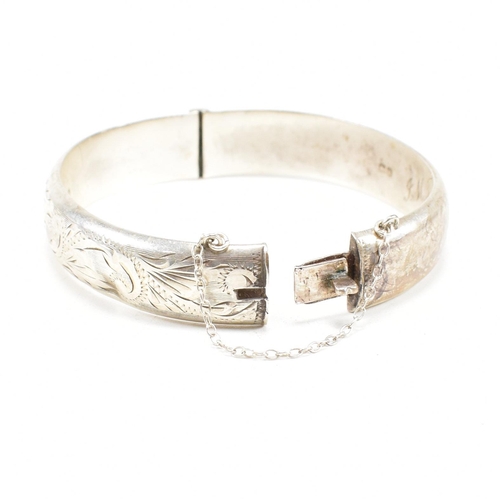 426 - A hallmarked 1970s silver hinged bangle. Monogram inscribed to interior of the band. Weight 20g. Mea... 