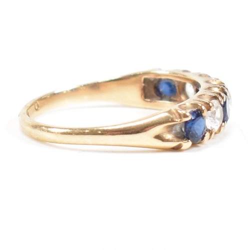 427 - A hallmarked 9ct gold synthetic sapphire and spinel seven stone ring. Weight 2.2g. Size N. All weigh... 