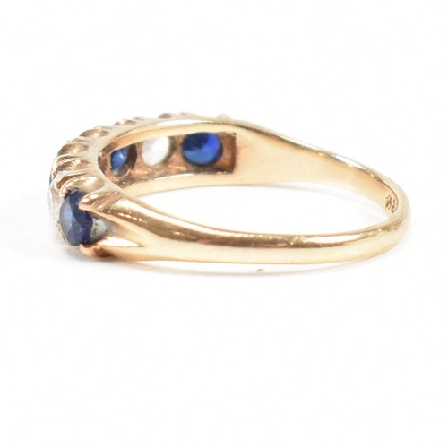 427 - A hallmarked 9ct gold synthetic sapphire and spinel seven stone ring. Weight 2.2g. Size N. All weigh... 