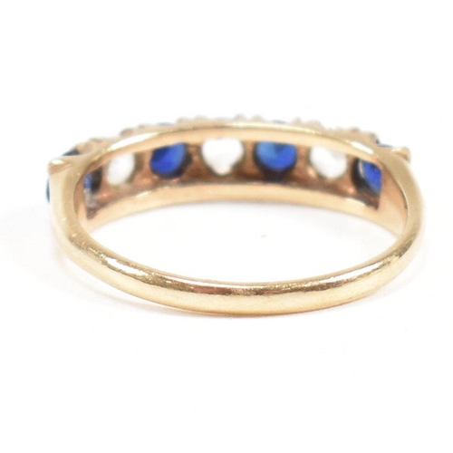 427 - A hallmarked 9ct gold synthetic sapphire and spinel seven stone ring. Weight 2.2g. Size N. All weigh... 