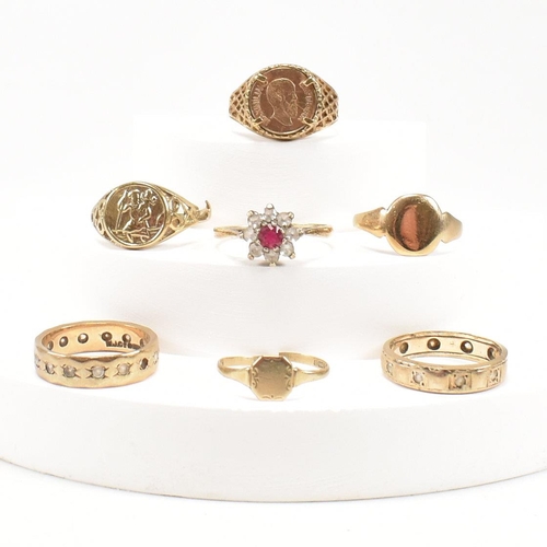 429 - A collection of gold rings. The rings to include hallmarked red and white stone cluster ring, a hall... 