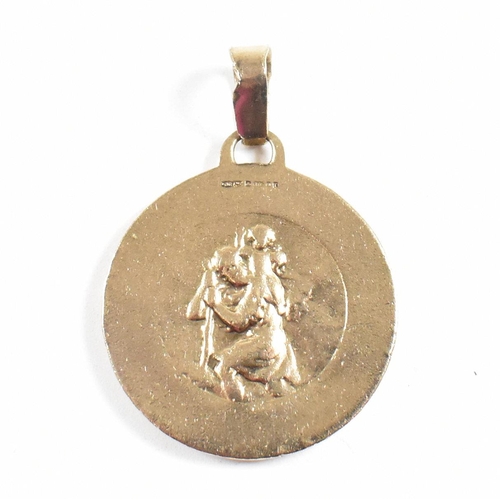 43 - A hallmarked 9ct gold pendant having St Christopher scene verso. Hallmarked London. Weight 19g. Meas... 