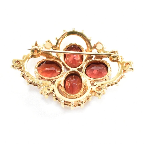 431 - Hallmarked 9ct gold garnet and pearl brooch pin. The brooch set with three oval cut garnet having ac... 