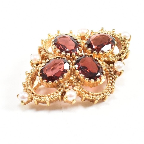 431 - Hallmarked 9ct gold garnet and pearl brooch pin. The brooch set with three oval cut garnet having ac... 