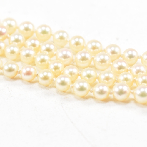 433 - A gold and cultured pearl necklace. The necklace strung with 3mm round pearls. Unmarked tests indica... 