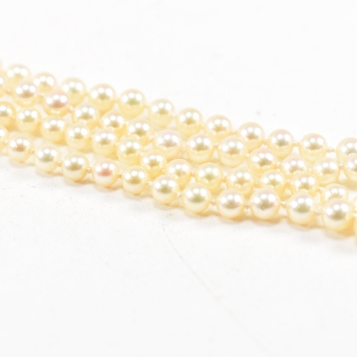 433 - A gold and cultured pearl necklace. The necklace strung with 3mm round pearls. Unmarked tests indica... 