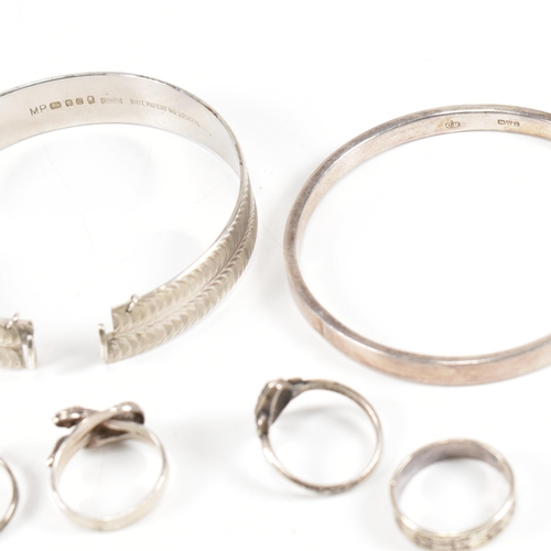 437 - A collection of silver jewellery. The jewellery to include two hallmarked silver bangles, four silve... 