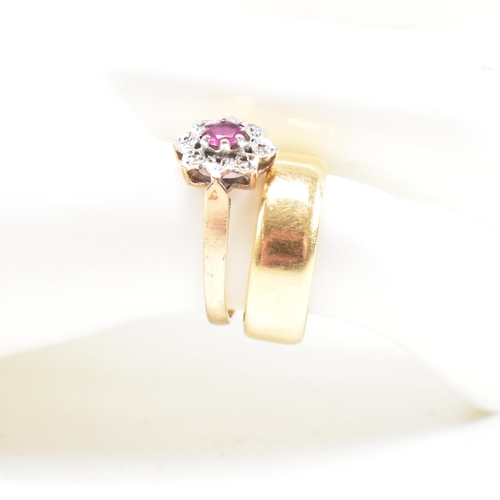 443 - A hallmarked 18ct gold band ring and a hallmarked 9ct gold ruby and diamond cluster ring. Weight 18c... 