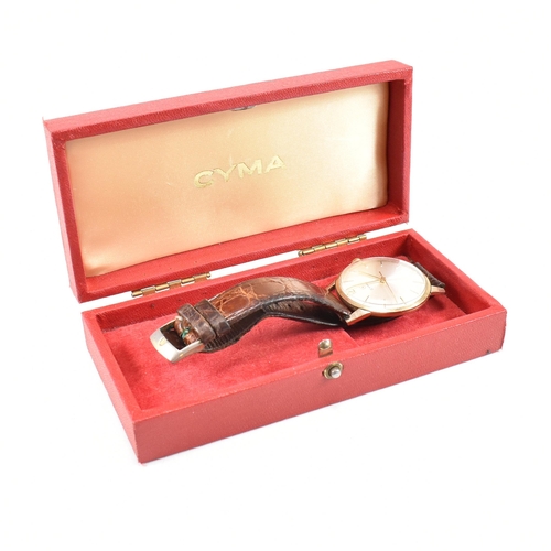 446 - A hallmarked 1960s 9ct gold Cyma gentleman's wrist watch. The watch having champagne dial with baton... 