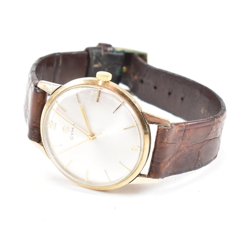 446 - A hallmarked 1960s 9ct gold Cyma gentleman's wrist watch. The watch having champagne dial with baton... 