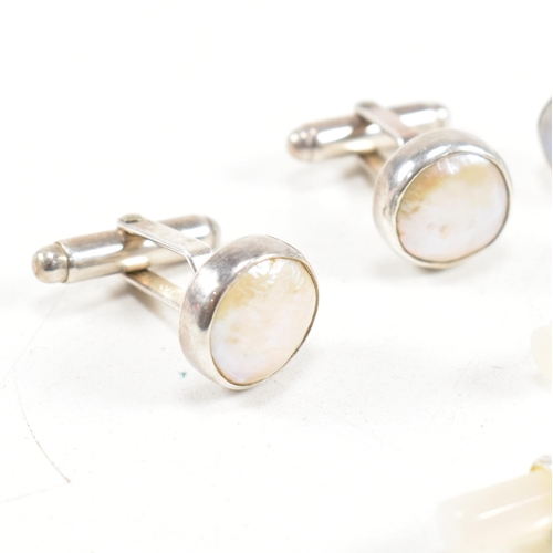 447 - A selection of 925 silver and gem set cufflinks. To include mother of pearl and moonstone. Marked 92... 