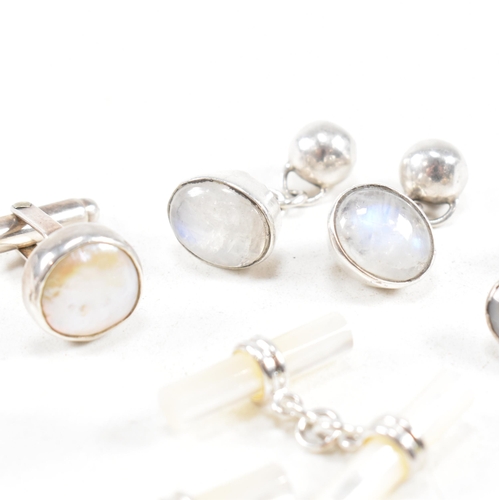 447 - A selection of 925 silver and gem set cufflinks. To include mother of pearl and moonstone. Marked 92... 