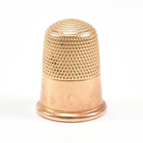 455 - A 19th century 18ct gold thimble. Tapering form with planished decoration. Stamped 18ct. Total weigh... 