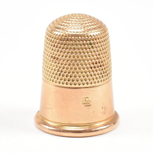 455 - A 19th century 18ct gold thimble. Tapering form with planished decoration. Stamped 18ct. Total weigh... 