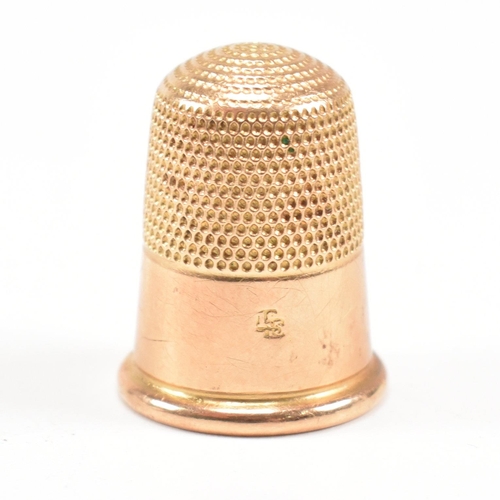 455 - A 19th century 18ct gold thimble. Tapering form with planished decoration. Stamped 18ct. Total weigh... 