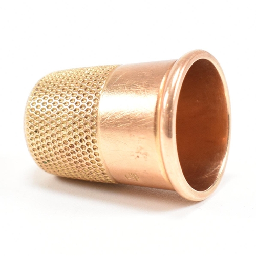 455 - A 19th century 18ct gold thimble. Tapering form with planished decoration. Stamped 18ct. Total weigh... 