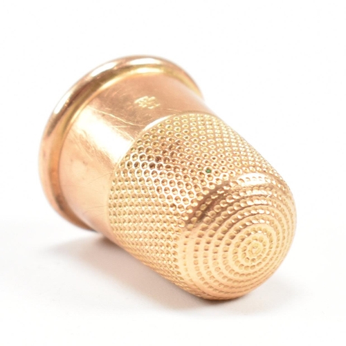 455 - A 19th century 18ct gold thimble. Tapering form with planished decoration. Stamped 18ct. Total weigh... 