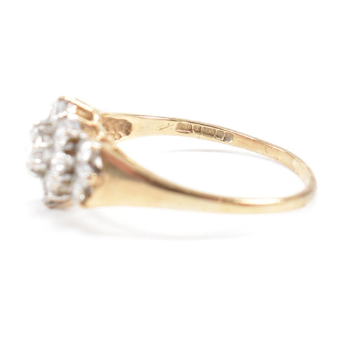 459 - A hallmarked 9ct gold and CZ cluster ring. Weight 2.4g. Size R. All weights, measurements and sizes ... 