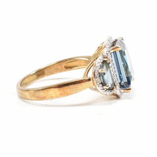 46 - A hallmarked 9ct gold topaz and diamond triple halo ring. Weight 3.9g. Size O. All weights, measurem... 