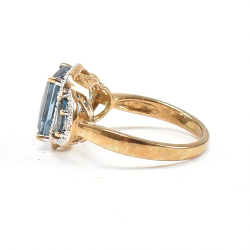 46 - A hallmarked 9ct gold topaz and diamond triple halo ring. Weight 3.9g. Size O. All weights, measurem... 