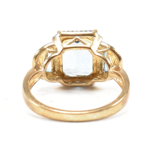 46 - A hallmarked 9ct gold topaz and diamond triple halo ring. Weight 3.9g. Size O. All weights, measurem... 