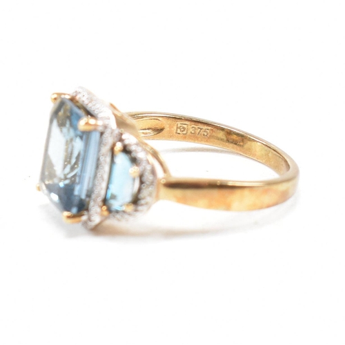 46 - A hallmarked 9ct gold topaz and diamond triple halo ring. Weight 3.9g. Size O. All weights, measurem... 