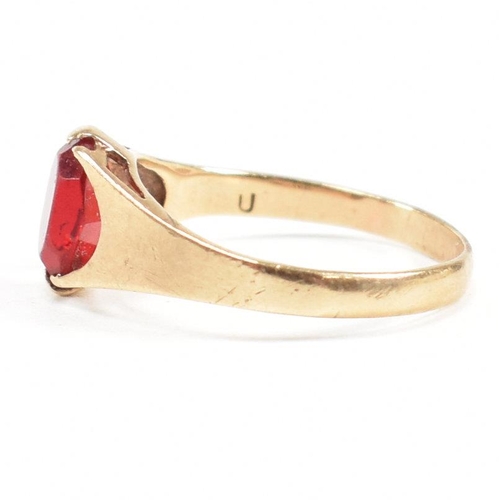 464 - A gold and red paste signet ring. Marked 9ct. Tests indicate gold. Weight 1.6g. Size L.5. All weight... 