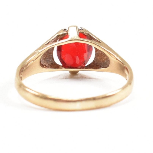 464 - A gold and red paste signet ring. Marked 9ct. Tests indicate gold. Weight 1.6g. Size L.5. All weight... 