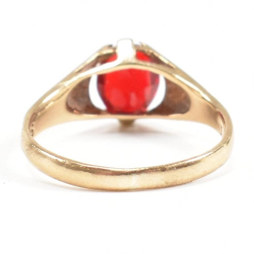 464 - A gold and red paste signet ring. Marked 9ct. Tests indicate gold. Weight 1.6g. Size L.5. All weight... 