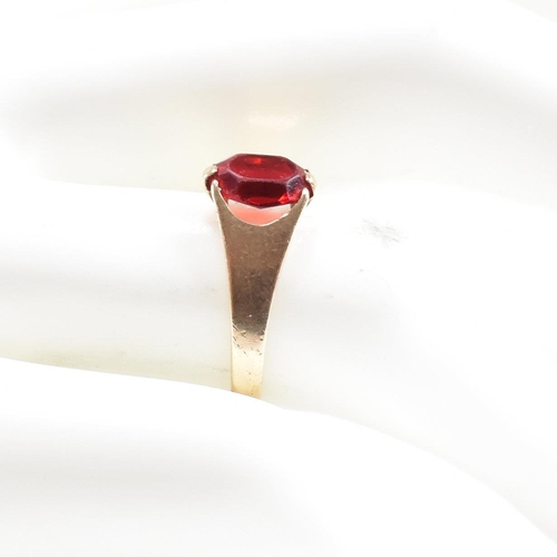 464 - A gold and red paste signet ring. Marked 9ct. Tests indicate gold. Weight 1.6g. Size L.5. All weight... 