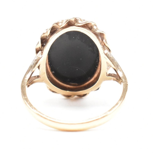 47 - A mid-century 9ct gold and onyx cabochon ring. Marked 9ct. Weight 4g. Size L.5. All weights, measure... 